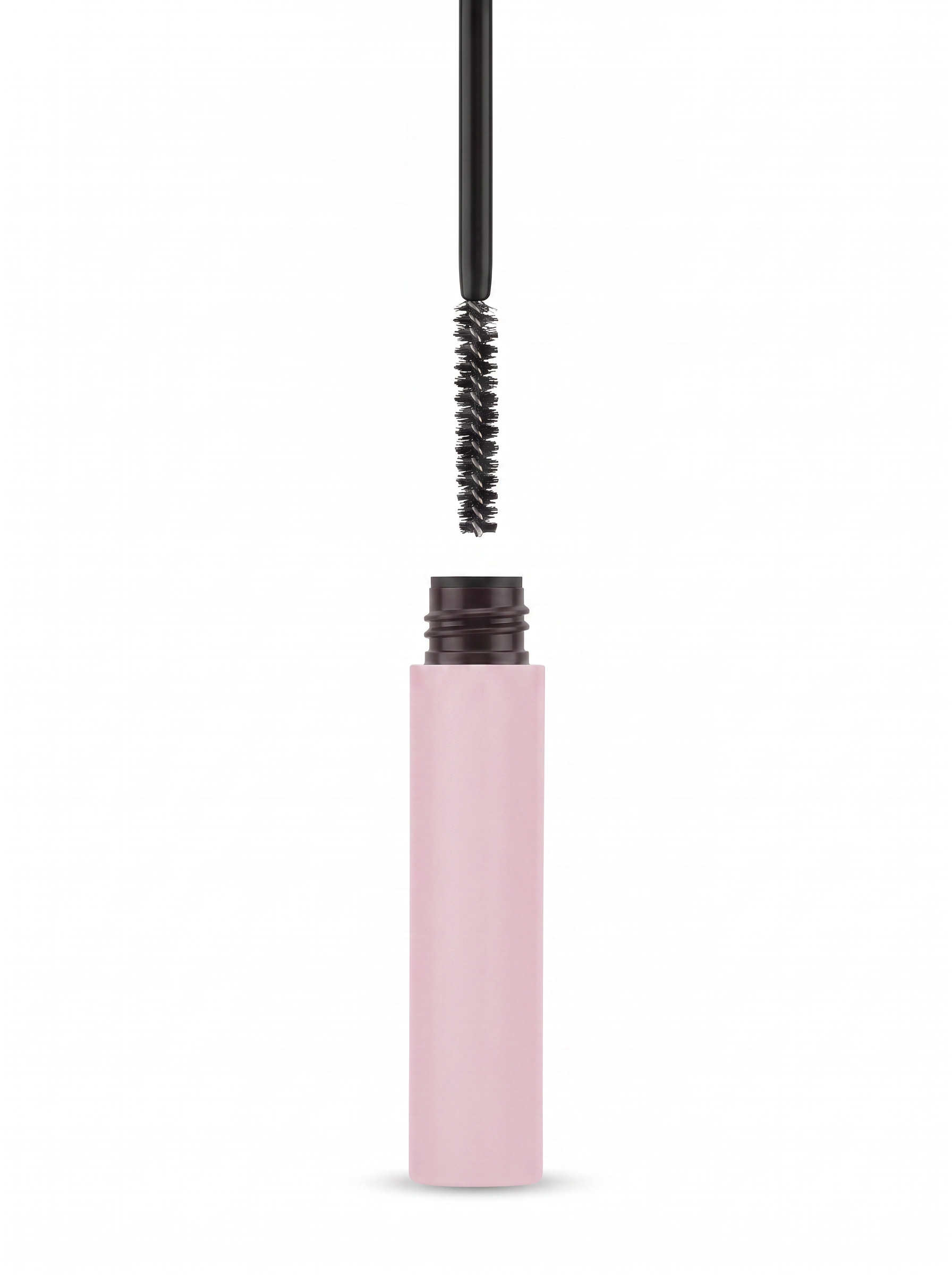 Milos Clear Brow Sculpting Gel — spoolie applicator above the open pink tube